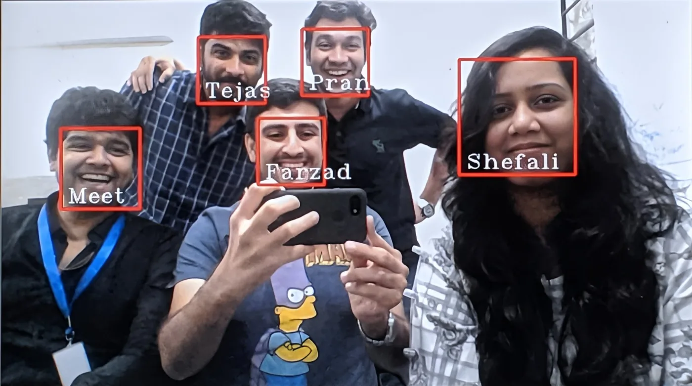 The system running on a group photo of my college friends, each face boxed in red with the name it recognised